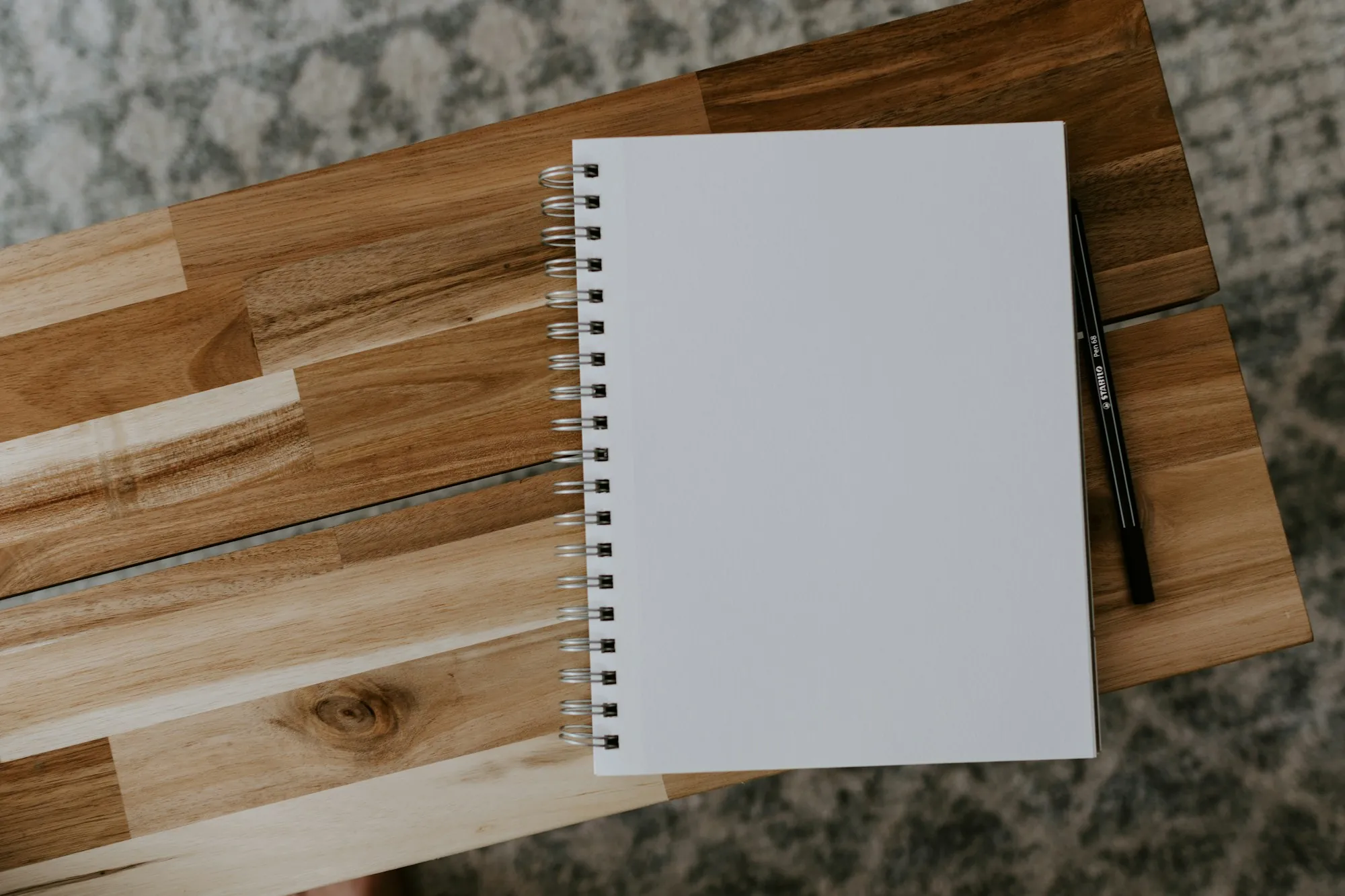 Blank notebook and pen on a wooden board, ready for notes on the life insurance contestability period, Kenilworth